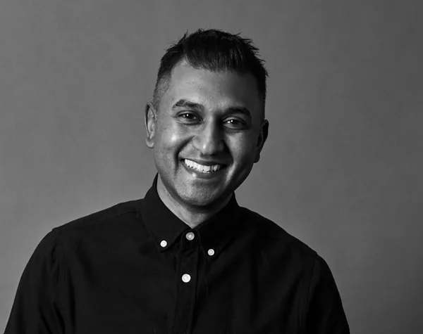 Black-and-white headshot of Eugene Perumal